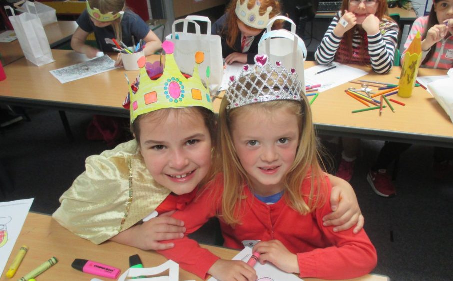 Hayley Robertson and Alexandria Bowman joining in the fun wearing paper crowns