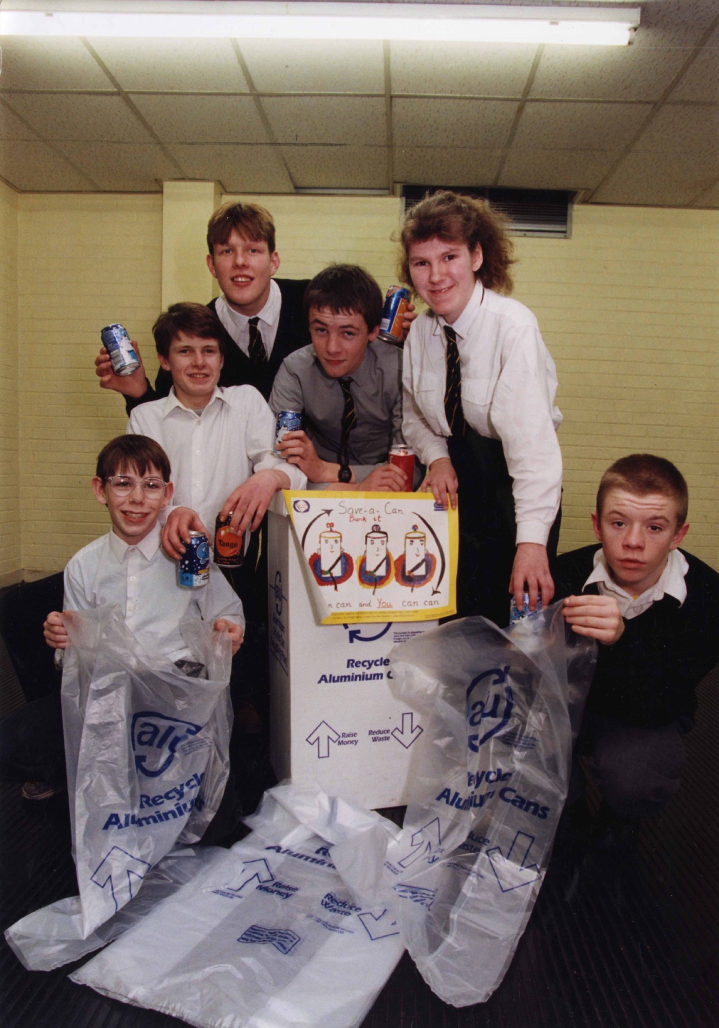 Pupils with cans and bags launching the recycling campaign. 