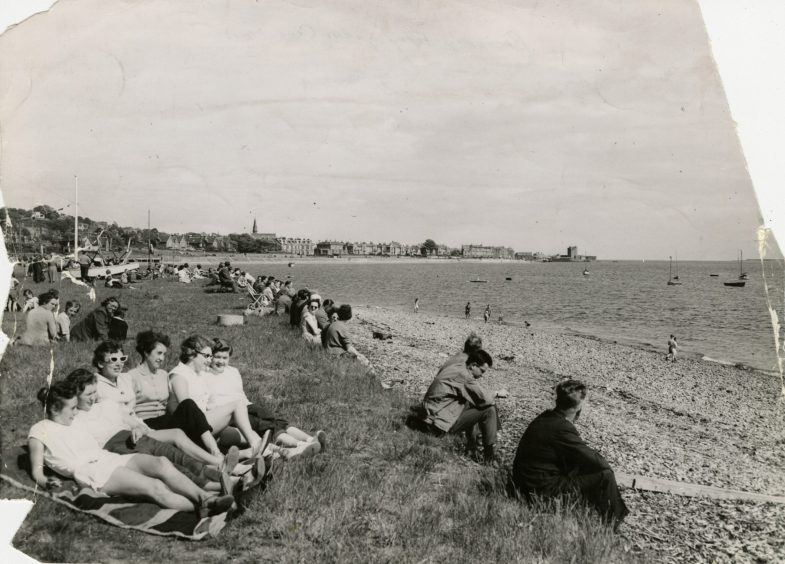 A crowd gathered along the West Ferry beach front watching yacht races in 1957. 