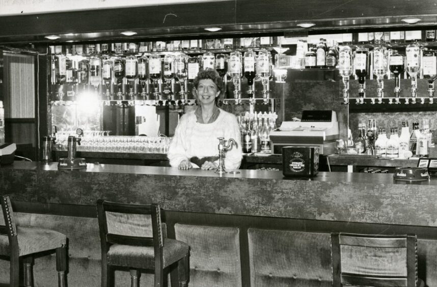 Behind the bar of Charlie's Lounge in the Royal Hotel in Monifieth is Mrs Jan McAnish.