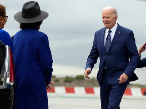 President Joe Biden greets Los Angeles Mayor Karen Bass as he arrives at Los Angeles International Airport ((Manuel Balce Ceneta/AP)