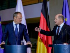 German chancellor Olaf Scholz, right, and Poland’s Prime Minister Donald Tusk attend a press conference in Berlin, Germany (Ebrahim Noroozi/AP)