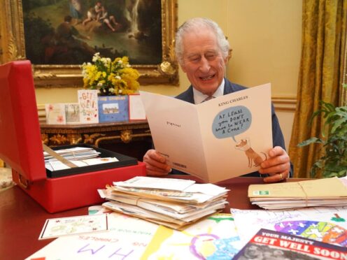 The King reads messages of support from well-wishers following his cancer diagnosis (Jonathan Brady/PA)