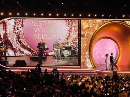 U2 presents the award for best pop vocal album remotely from the Sphere in Las Vegas during the 66th annual Grammy Awards on Sunday, Feb. 4, 2024, in Los Angeles. (AP Photo/Chris Pizzello)