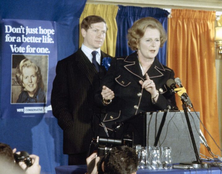 Margaret Thatcher on stage and behind a lectern while campaigning for the 1979 general election. 