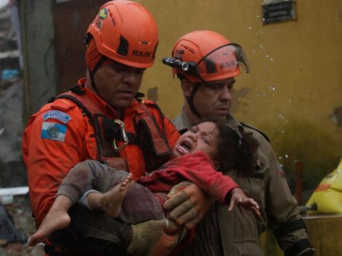 A girl was rescued from her collapsed house (Bruna Prado/AP)