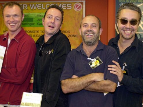 Karl Wallinger, right, with Gary Kemp, left, Joe Strummer, centre left, and Keith Allen, centre right (Kirsty Wigglesworth/PA)