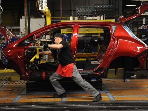 A view showing the dashboard being fitted on the production line of the Nissan Leaf electric car at the Nissan Plant, Sunderland.