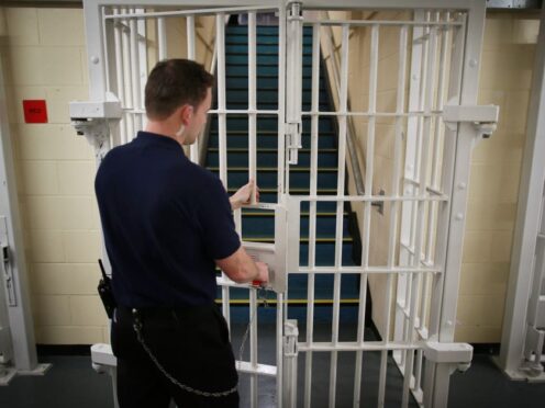 A door is closed by a prison guard at the Cookham Wood Young Offender Institution in Rochester (Peter Macdiarmid/PA)
