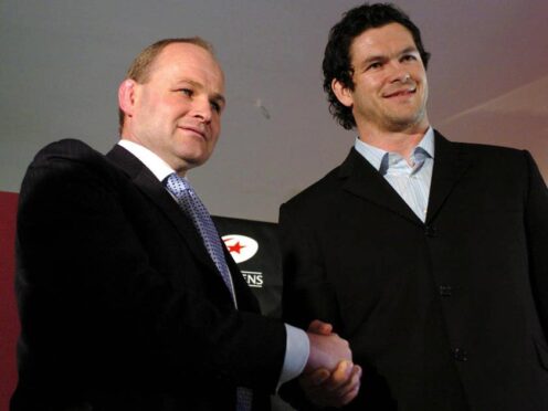 Andy Farrell, right, shakes hands with England head coach Andy Robinson after signing for Saracens in 2005 (Chris Radburn/PA)