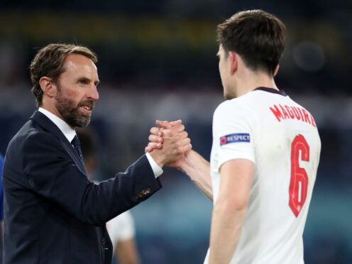England manager Gareth Southgate shakes hands with Harry Maguire. (Nick Potts/PA)