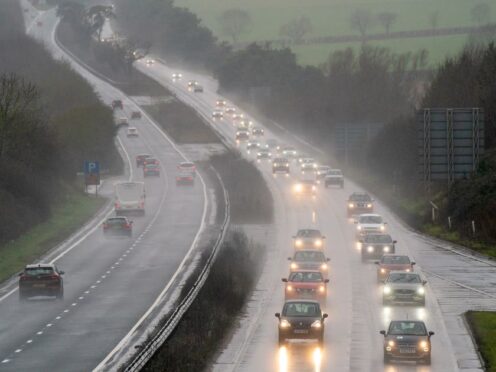Heavy rain is expected to disrupt more than two million return journeys (Joe Giddens/PA)