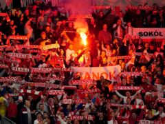 Poland fans set off flares in the stands at Cardiff City Stadium in September 2022 (Mike Egerton/PA)