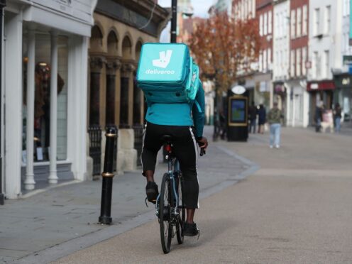 Food delivery giant Deliveroo is offering free childcare to riders (David Davies/PA)
