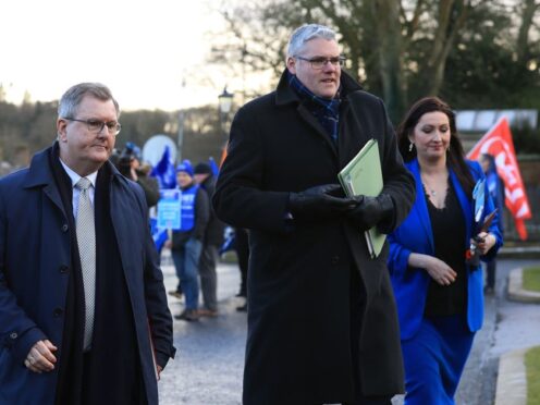 (l to r) Sir Jeffrey Donaldson, Gavin Robinson and Emma Little-Pengelly leave Hillsborough Castle in January (Liam McBurney/PA)