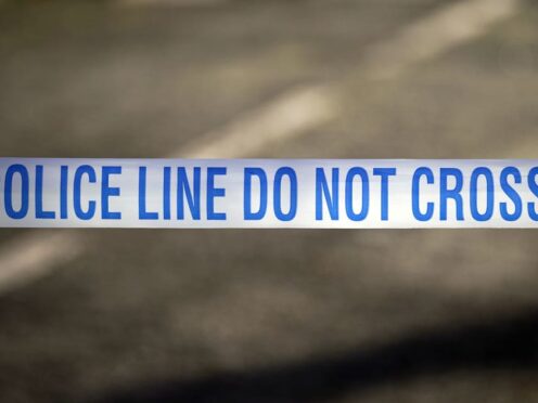 Stock image of police tape at a crime scene. (Peter Byrne/PA)