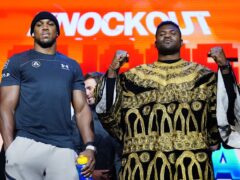 Anthony Joshua, left, weighed in at almost two stones lighter than Francis Ngannou, right (Zac Goodwin/PA)