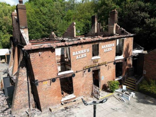 The Crooked House was destroyed by fire (Jacob King/PA)