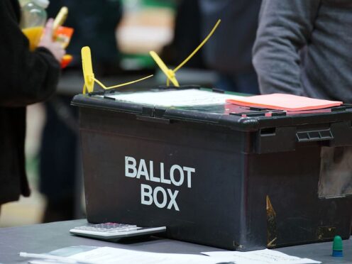 A ballot box arrives as polls close and counting begins at Rochdale Leisure Centre (Peter Byrne/PA)