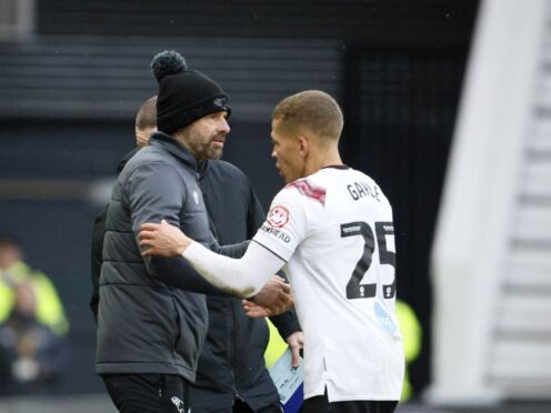 Derby manager Paul Warne (left) shakes hands with Dwight Gayle after he is substituted during the win over Port Vale (Richard Sellers/PA)