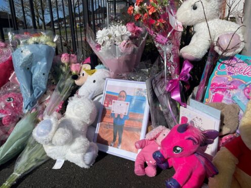 Floral tributes to 10-year-old Shay Kang placed near her home (Matthew Cooper/PA)