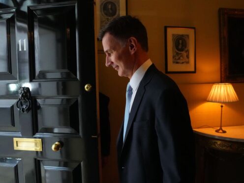 Chancellor of the Exchequer Jeremy Hunt exits 11 Downing Street ahead of delivering his Budget (Carl Court/PA)