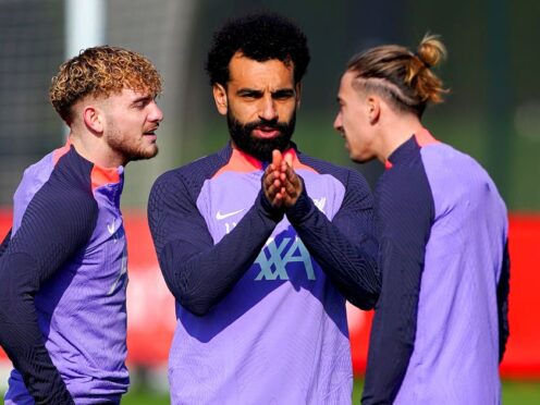 Liverpool’s Harvey Elliott, left, Mohamed Salah, centre, and Kostas Tsimikas, right, in training (Peter Byrne/PA)