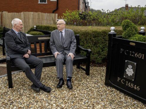 Bryn Hughes (left) and Paul Bone, the fathers of murdered Pcs Nicola Hughes and Fiona Bone, at the Hyde police station memorial garden in Manchester (Peter Byrne/PA)