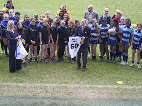 The Duke and Duchess of Edinburgh are presented with number 60 rugby shirts (Danny Lawson/PA)