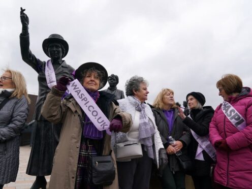 Campaigners for Women Against State Pension Inequality gather at the statue of political activist Mary Barbour (Andrew Milligan/PA)