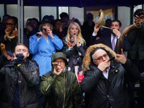 People blowing shofars and whistles led by Vanessa Feltz and Dame Maureen Lipman (Victoria Jones/PA)