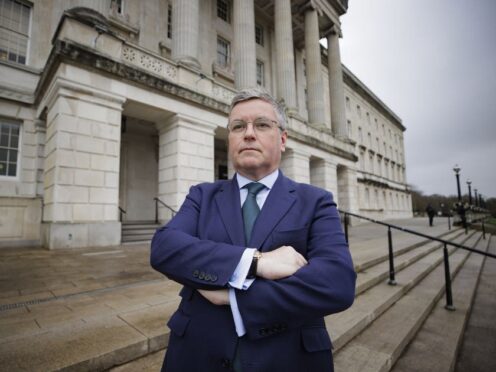 Sir Robert Buckland, chair of the Northern Ireland Affairs Committee, poses for a photograph at Stormont after a committee meeting (Liam McBurney/PA)