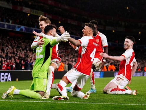 Arsenal celebrate after David Raya saved two penalties in the shoot-out (Zac Goodwin/PA)