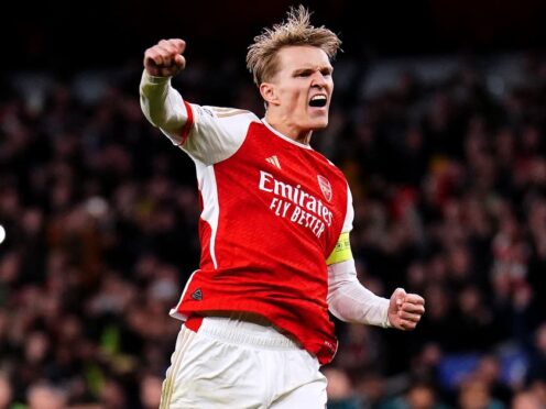 Arsenal captain Martin Odegaard celebrates after scoring the first penalty of the shoot-out win over Porto (Zac Goodwin/PA)
