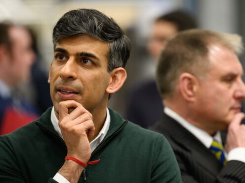 Prime Minister Rishi Sunak (left) and Conservative MP for Filton and Bradley Stoke Jack Lopresti listen to information on engine development during a visit to the Rolls-Royce manufacturing facility in Bristol (PA)