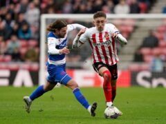 Sunderland’s Dan Neil battles for the ball against QPR’s Lucas Andersen (Owen Humphreys/PA)