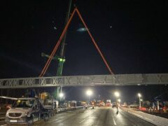 A gantry being installed overnight on a closed section of the M25 motorway in Surrey (National Highways South-East/PA)