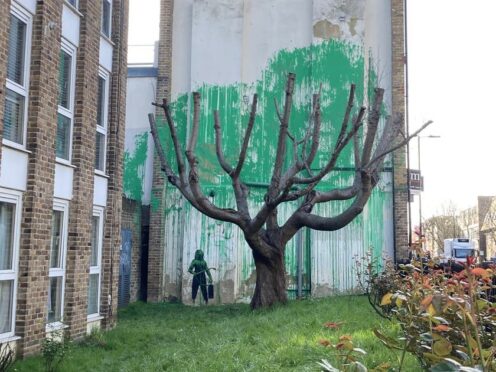 A new piece of art work, which has appeared on the side of a building on Hornsey Road in Finsbury Park, London, is suspected of being by street artist Banksy (Ella Nunn/PA)