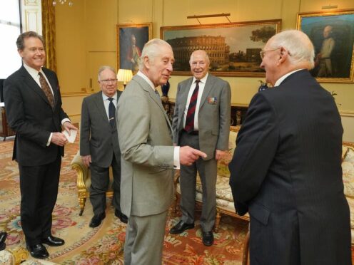 The King, along with Master of The King’s Household Vice Admiral Sir Tony Johnstone-Burt (left), during an audience with veterans of the Korean War Alan Guy, Mike Mogridge and Brian Parritt, at Buckingham Palace (Jonathan Brady/PA)