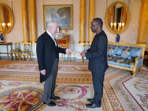 Tanzanian High Commissioner Mbelwa Kairuki presents his credentials to the King during a private audience at Buckingham Palace (Jonathan Brady/PA)