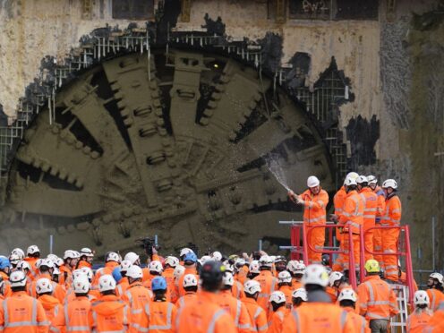 Champagne is sprayed after the boring machine Cecelia breaks through (Andrew Matthews/PA)