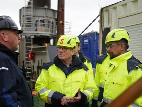 Labour leader Sir Keir Starmer, centre, and new Welsh First Minister Vaughan Gething, right, during a visit to the Port of Holyhead in North Wales (Peter Byrne/PA)