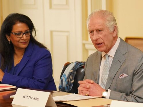 The King during a meeting in the Billiard Room at Buckingham Palace with Vijaya Nath (left), and with community faith leaders from across the UK (Jonathan Brady/PA)