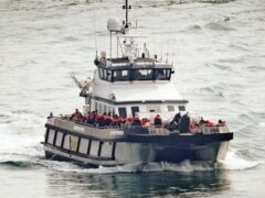 A group of people thought to be migrants are brought into Dover, Kent, onboard a Border Force vessel following a small boat incident in the Channel (Gareth Fuller/PA)
