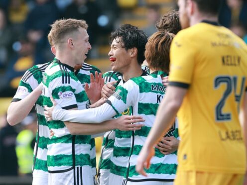 Celtic players celebrate after Jamie Brandon’s own goal (Steve Welsh/PA)