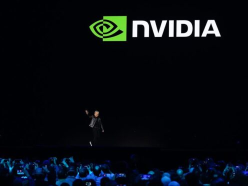 CEO Jensen Huang walks on stage before the keynote address of Nvidia GTC in San Jose, California (Eric Risberg/PA)