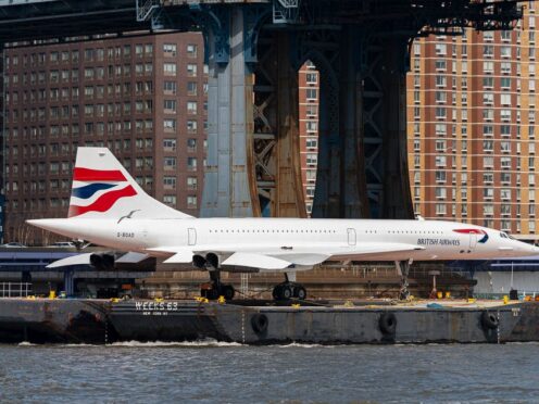 A retired British Airways Concorde supersonic aircraft is transported by barge on the East River in New York. (AP Photo/Peter K. Afriyie)