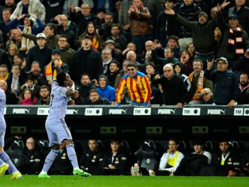Vinicius Junior scored twice as Real Madrid came from 2-0 to draw at Valencia (Jose Breton/AP)