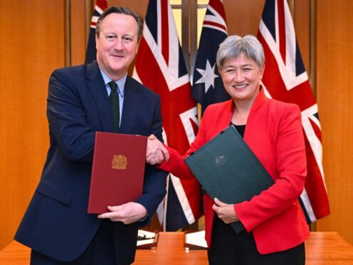 Britain’s Foreign Secretary David Cameron and Australian Foreign Minister Penny Wong after signing an agreement at Parliament House in Canberra (Lukas Coch/AAP Image/AP)