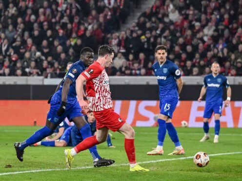 Freiburg’s Michael Gregoritsch, centre left, scores the opening goal during the Europa League round of 16 first leg soccer match between SC Freiburg West Ham United at the Europa-Park Stadion in Freiburg, Germany, Thursday, March 7, 2024. (Harry Langer/dpa via AP)
